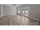 Living room with new floors, neutral paint, and access to a private patio at 3804 Freedom Dr, Charlotte, NC 28208