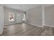 Living room featuring a bright entry, modern finishes, and neutral paint at 3804 Freedom Dr, Charlotte, NC 28208