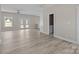 Living room featuring modern finishes, new floors and view to the bath and backyard at 3804 Freedom Dr, Charlotte, NC 28208