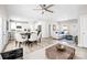 Bright, open-concept living room featuring modern decor and an adjacent dining area with a white and neutral color palette at 3804 Freedom Dr, Charlotte, NC 28208