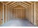 Empty interior shed with concrete floor, white supports, and plywood walls ready for customization at 3804 Freedom Dr, Charlotte, NC 28208