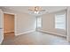 Bedroom features neutral walls, wood-look flooring, and a ceiling fan at 417 Spring Sw St, Concord, NC 28025
