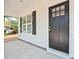 Up-close view of the stylish front door, complemented by black shutters and a well-maintained porch at 417 Spring Sw St, Concord, NC 28025