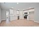 Bright kitchen featuring stainless steel appliances, white cabinets, and wood-look flooring at 417 Spring Sw St, Concord, NC 28025