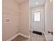 Mud room featuring a white door and wire shelving at 417 Spring Sw St, Concord, NC 28025