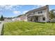Spacious backyard featuring a well-manicured lawn and a screened-in porch for outdoor relaxation at 428 Whitewater Nw Way, Concord, NC 28027