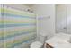The full bathroom offers a shower with curtain and a vanity with modern fixtures at 428 Whitewater Nw Way, Concord, NC 28027