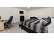 Spacious bedroom featuring neutral walls, plush carpeting, and a large window, providing a tranquil retreat at 428 Whitewater Nw Way, Concord, NC 28027