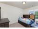 Bright bedroom with a built-in headboard and drawers providing ample storage and natural light at 428 Whitewater Nw Way, Concord, NC 28027
