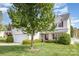 Suburban home featuring a well-manicured lawn and a two car garage at 428 Whitewater Nw Way, Concord, NC 28027