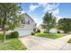 Suburban home featuring a well-manicured lawn and a two car garage at 428 Whitewater Nw Way, Concord, NC 28027