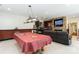 Large basement featuring pool table, wet bar, stone fireplace and sofa, great for entertaining at 4925 Pageland Hwy, Monroe, NC 28112