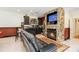 Basement features a stone fireplace, wet bar, comfortable seating and a cozy ambiance at 4925 Pageland Hwy, Monroe, NC 28112