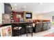 Entertaining basement with a stone fireplace, wet bar, TV, and comfortable seating area at 4925 Pageland Hwy, Monroe, NC 28112