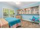 Bedroom features a large window, built-in shelving, and a cheerful color palette at 4925 Pageland Hwy, Monroe, NC 28112
