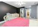 Comfortable bedroom featuring a cozy bed, a crib, closet and natural light at 4925 Pageland Hwy, Monroe, NC 28112
