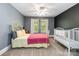 Comfortable bedroom featuring a cozy bed, a crib and natural light at 4925 Pageland Hwy, Monroe, NC 28112