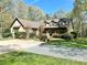 Charming home featuring manicured landscaping, dormer windows and a welcoming front porch perfect for relaxing at 4925 Pageland Hwy, Monroe, NC 28112