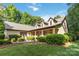 Charming home with a welcoming porch and lush landscaping, creating an inviting curb appeal at 4925 Pageland Hwy, Monroe, NC 28112