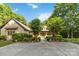 Beautiful home surrounded by lush trees and landscaping creating a private and inviting atmosphere at 4925 Pageland Hwy, Monroe, NC 28112