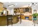 Well-lit kitchen featuring granite countertops, tile flooring, and ample cabinet space at 4925 Pageland Hwy, Monroe, NC 28112