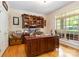 Charming office space with built in cabinetry, wood floors, and natural light at 4925 Pageland Hwy, Monroe, NC 28112