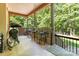 Spacious covered outdoor bar area features bar seating and a view of the backyard at 4925 Pageland Hwy, Monroe, NC 28112