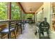 A covered outdoor bar with seating and a grill at 4925 Pageland Hwy, Monroe, NC 28112