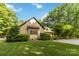 Side view of home featuring lush green lawn and manicured landscaping at 4925 Pageland Hwy, Monroe, NC 28112