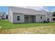 Exterior of a home featuring a covered patio and well-maintained backyard at 5602 Skinny Dr, Charlotte, NC 28215