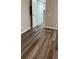 Neutral bedroom featuring wood-look flooring and a white closet door at 5767 Swinging Bridge Rd, Conover, NC 28613