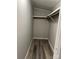 Walk-in closet features wood-look flooring and a shelf for organization at 5767 Swinging Bridge Rd, Conover, NC 28613
