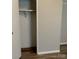 Walk-in closet features wood-look flooring and a shelf for storage at 5767 Swinging Bridge Rd, Conover, NC 28613