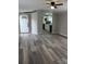 Open-concept living area showcasing gray flooring and a clear view into the adjacent kitchen at 5767 Swinging Bridge Rd, Conover, NC 28613