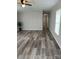 Bright living room featuring modern flooring and a seamless transition to the hallway at 5767 Swinging Bridge Rd, Conover, NC 28613