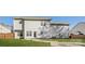 The home's backyard is complete with a lush lawn and a stone walkway to a patio for entertaining at 6111 Panache Dr, Matthews, NC 28104
