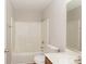 Bright bathroom featuring a toilet, vanity with sink, and a shower-tub combination with white tiling at 6111 Panache Dr, Matthews, NC 28104