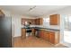 Functional kitchen with stainless steel appliances, light wood cabinets and a view to the backyard at 6111 Panache Dr, Matthews, NC 28104