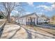 Charming cottage-style home with a well-manicured lawn and inviting front porch at 705 Sumter St, Lancaster, SC 29720