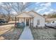 This house offers charming curb appeal with its inviting porch and manicured lawn, a perfect welcome at 705 Sumter St, Lancaster, SC 29720
