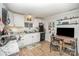 Bright kitchen with white cabinets, granite countertops, and modern appliances offers lots of charm at 705 Sumter St, Lancaster, SC 29720