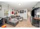 Comfortable living room with wood floors, gray sectional and media center at 705 Sumter St, Lancaster, SC 29720