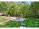 The backyard features a fire pit, playground, and access to the adjacent shed at 73 Wyth Sw Ct, Concord, NC 28025