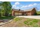 The backyard features a large brick home, a basketball hoop, and a fire pit at 73 Wyth Sw Ct, Concord, NC 28025