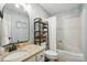 Updated bathroom featuring modern fixtures, neutral paint, new vanity, and shower with tub at 73 Wyth Sw Ct, Concord, NC 28025