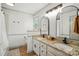 Bright bathroom with granite countertops, modern fixtures, double sinks, and updated cabinetry at 73 Wyth Sw Ct, Concord, NC 28025