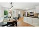 Eat-in kitchen with stainless steel appliances and black countertops, leading to an outdoor patio at 73 Wyth Sw Ct, Concord, NC 28025