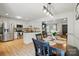 Open kitchen with stainless steel appliances, granite countertops, and modern light fixtures at 73 Wyth Sw Ct, Concord, NC 28025