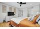 Comfortable bedroom featuring hardwood floors, neutral walls, and modern ceiling fan at 73 Wyth Sw Ct, Concord, NC 28025
