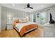 Spacious main bedroom with hardwood floors, decorative accent wall, and lots of natural light at 73 Wyth Sw Ct, Concord, NC 28025